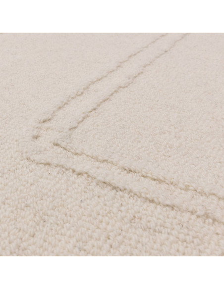Elevate your space with the Ada Ivory boho rug, featuring a soft geometric design and natural wool for lasting comfort and time