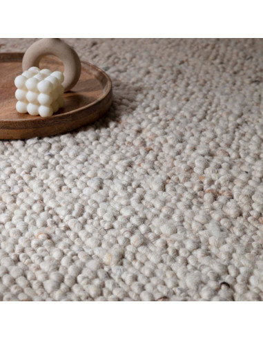Elevate your space with the Adler Ivory boho rug, featuring handwoven natural wool for plush comfort and timeless bohemian styl