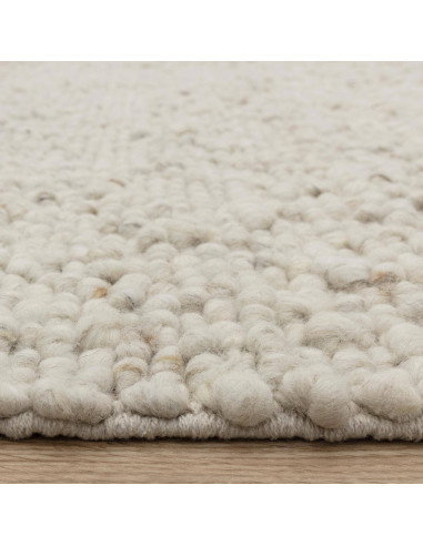 Elevate your space with the Adler Ivory boho rug, featuring handwoven natural wool for plush comfort and timeless bohemian styl