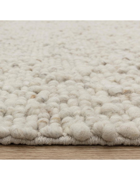 Elevate your space with the Adler Ivory boho rug, featuring handwoven natural wool for plush comfort and timeless bohemian styl