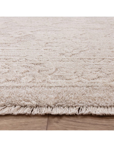 Elevate your space with the Laurent LA04 beige boho rug, featuring a subtle abstract design and durable, easy-care polyester fi