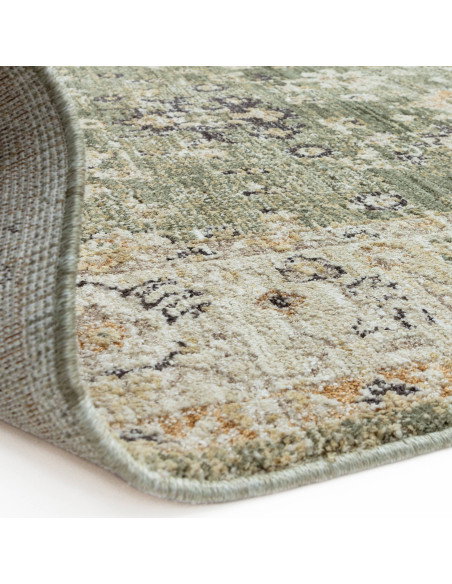 Elevate your space with the Heriz Ornate Green classic rug, featuring a timeless medallion pattern and durable, easy-care polye
