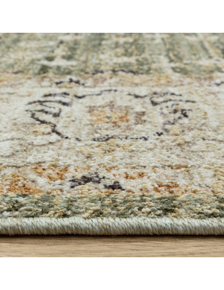 Elevate your space with the Heriz Ornate Green classic rug, featuring a timeless medallion pattern and durable, easy-care polye
