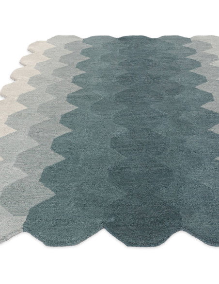 Elevate your space with the Hive Teal modern designer rug, featuring a geometric pattern and plush wool texture for timeless st
