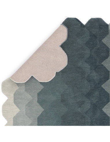 Elevate your space with the Hive Teal modern designer rug, featuring a geometric pattern and plush wool texture for timeless st