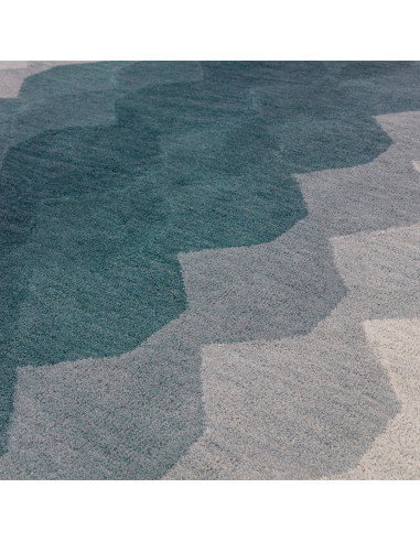 Elevate your space with the Hive Teal modern designer rug, featuring a geometric pattern and plush wool texture for timeless st