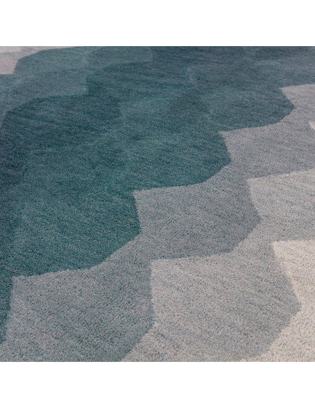Elevate your space with the Hive Teal modern designer rug, featuring a geometric pattern and plush wool texture for timeless st