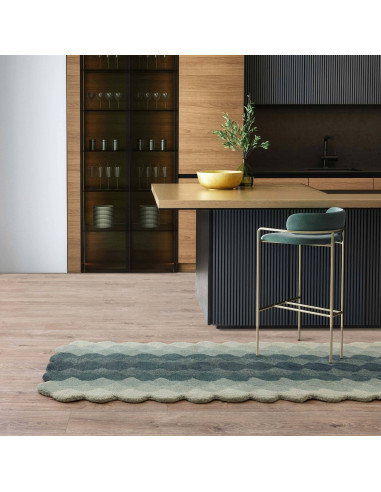 Elevate your space with the Hive Teal modern designer rug, featuring a geometric pattern and plush wool texture for timeless st