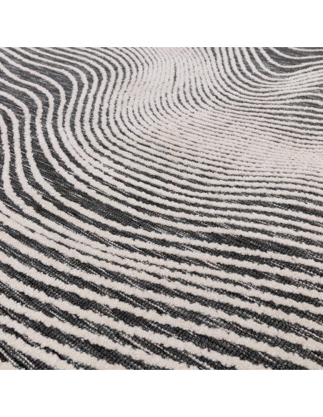 Elevate your space with the Mason Magnitude Black, a modern designer rug featuring an abstract geometric pattern and durable, e
