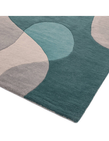 Elevate your space with the Matrix MAX57 Arc Teal, a modern designer rug featuring geometric elegance in rich teal and soft gre