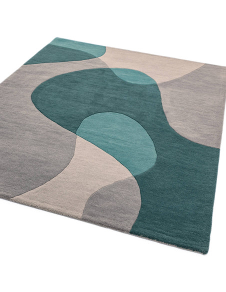 Elevate your space with the Matrix MAX57 Arc Teal, a modern designer rug featuring geometric elegance in rich teal and soft gre