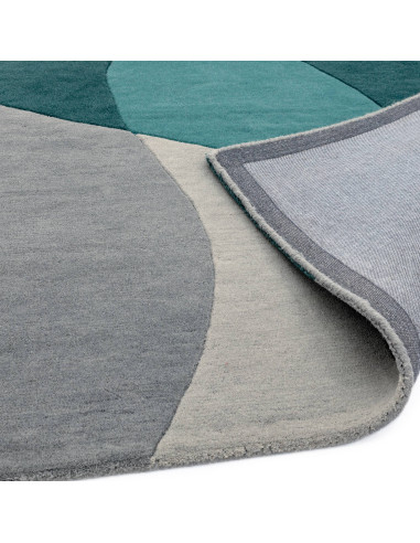 Elevate your space with the Matrix MAX57 Arc Teal, a modern designer rug featuring geometric elegance in rich teal and soft gre