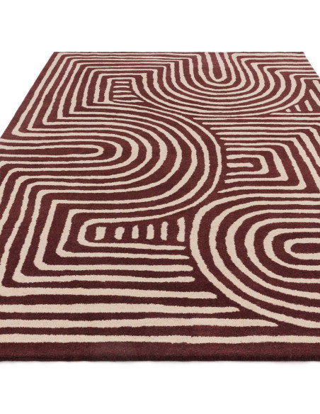 Elevate your space with the Reef RF29 Curve Plum, a modern designer rug featuring bold geometry and plush natural wool for last