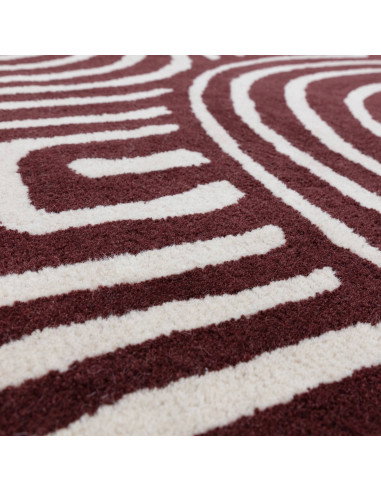 Elevate your space with the Reef RF29 Curve Plum, a modern designer rug featuring bold geometry and plush natural wool for last