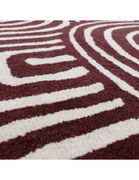 Elevate your space with the Reef RF29 Curve Plum, a modern designer rug featuring bold geometry and plush natural wool for last