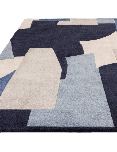 Elevate your space with the Romy 11 Element Blue, a modern designer rug featuring a bold geometric pattern and durable, easy-ca