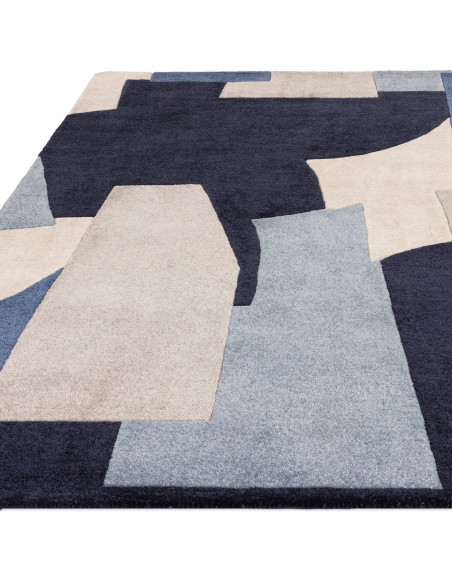 Elevate your space with the Romy 11 Element Blue, a modern designer rug featuring a bold geometric pattern and durable, easy-ca
