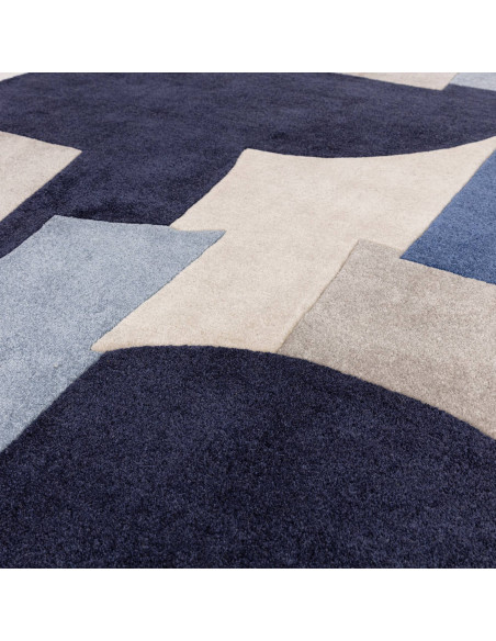 Elevate your space with the Romy 11 Element Blue, a modern designer rug featuring a bold geometric pattern and durable, easy-ca