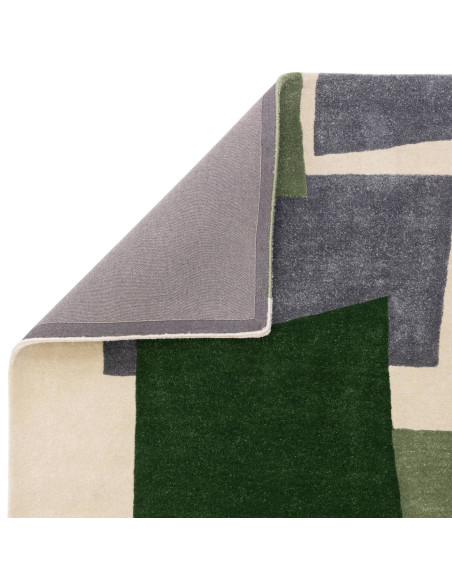 Elevate your space with the Romy 12 Papercut Green, a durable and stylish modern designer rug featuring bold geometric patterns