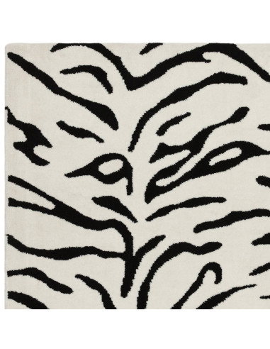 Elevate your space with the Wilder Tiger Mono rug, a bold modern designer rug featuring a striking black and white animal patte