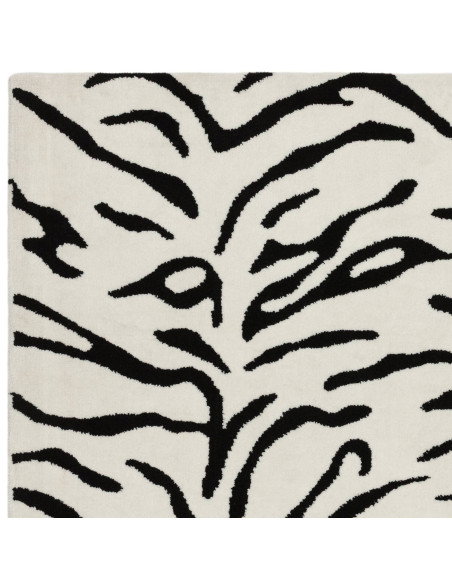 Elevate your space with the Wilder Tiger Mono rug, a bold modern designer rug featuring a striking black and white animal patte