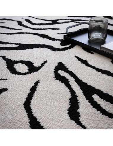 Elevate your space with the Wilder Tiger Mono rug, a bold modern designer rug featuring a striking black and white animal patte