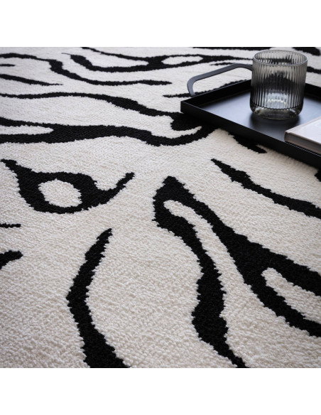Elevate your space with the Wilder Tiger Mono rug, a bold modern designer rug featuring a striking black and white animal patte