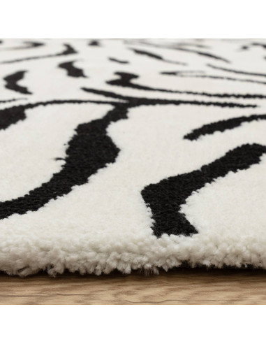 Elevate your space with the Wilder Tiger Mono rug, a bold modern designer rug featuring a striking black and white animal patte