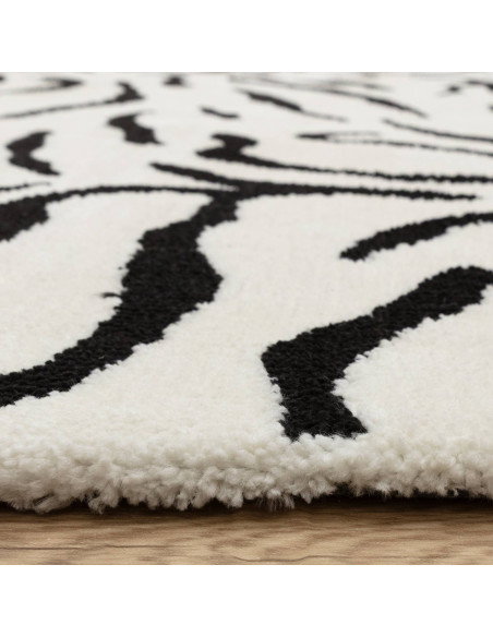 Elevate your space with the Wilder Tiger Mono rug, a bold modern designer rug featuring a striking black and white animal patte