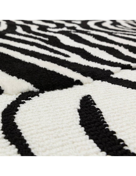 Bold black and white Wilder Zebra Mono rug blends fantasy and modern style, offering durable, plush comfort for any room’s déco