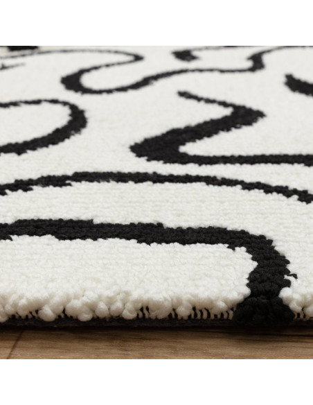 Bold black and white Wilder Zebra Mono rug blends fantasy and modern style, offering durable, plush comfort for any room’s déco