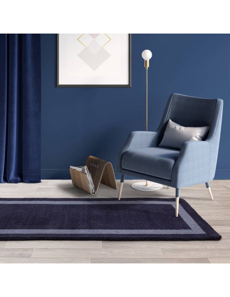 Elevate your space with the Albi Navy rug, a minimalist rug crafted from natural wool featuring a sleek geometric border and du