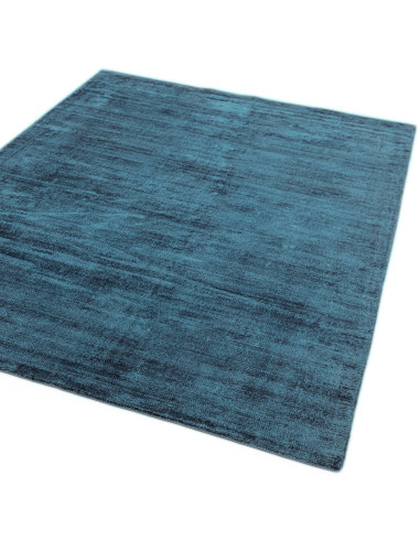 Elevate your space with the Blade Teal minimalist rug, featuring soft natural viscose and a sleek, elegant plain color design f