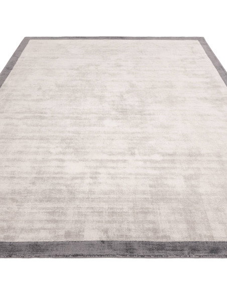 Elevate your space with the Blade Border Silver/Grey 08, a handcrafted minimalist rug featuring a subtle geometric border in el