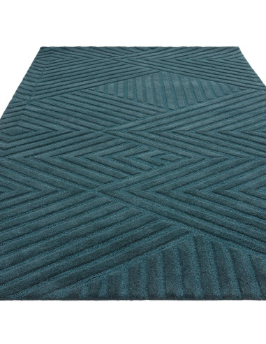 Elevate your space with the Hague Teal Rug, a minimalist rug crafted from natural wool featuring an elegant geometric design an