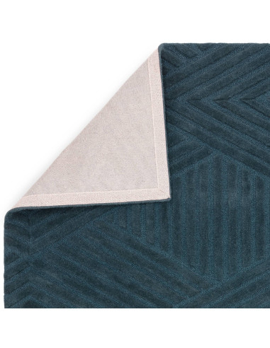 Elevate your space with the Hague Teal Rug, a minimalist rug crafted from natural wool featuring an elegant geometric design an