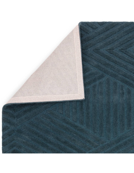 Elevate your space with the Hague Teal Rug, a minimalist rug crafted from natural wool featuring an elegant geometric design an