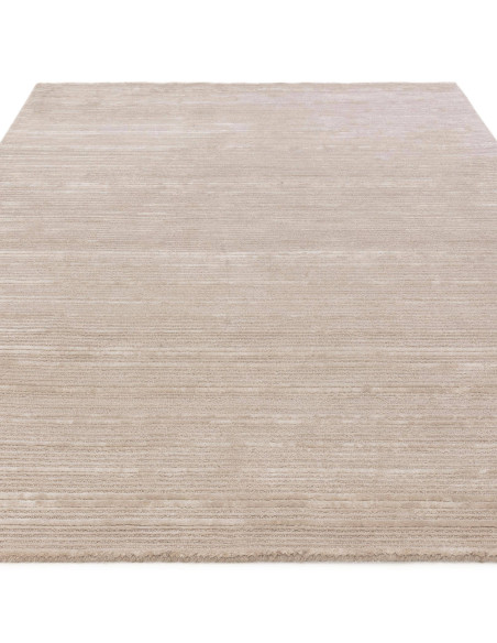 Elevate your space with the Henley Putty rug, a handcrafted minimalist rug in a timeless neutral shade for cozy, elegant living