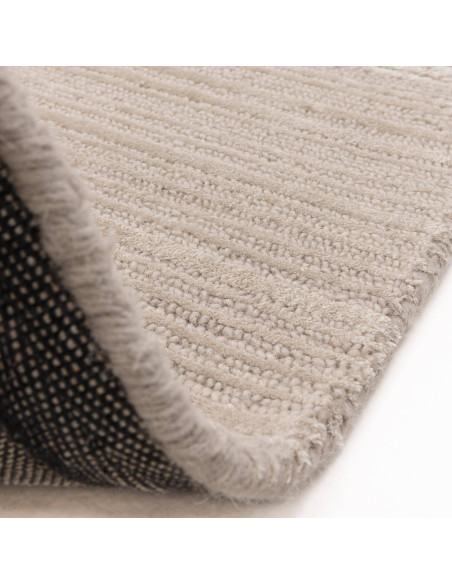 Elevate your space with the Henley Putty rug, a handcrafted minimalist rug in a timeless neutral shade for cozy, elegant living