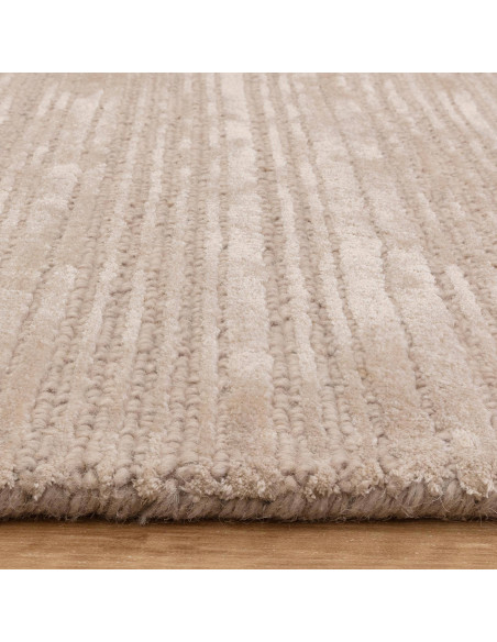 Elevate your space with the Henley Putty rug, a handcrafted minimalist rug in a timeless neutral shade for cozy, elegant living