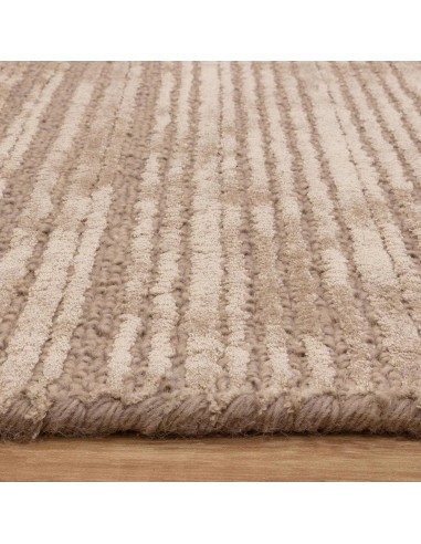 Elevate your space with the Henley Sand rug, a handcrafted minimalist rug in a warm neutral tone, blending comfort and timeless