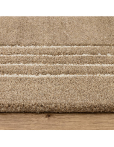 Tappeto Orlo Cocoa in lana naturale, tinta unita, perfetto per ambienti moderni. Eleganza minimal e comfort superiore garantiti