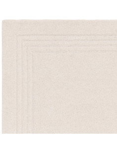 Tappeto Orlo Ivory in lana naturale, tinta unita, perfetto per ambienti minimal. Eleganza, comfort e qualità artigianale made i 2