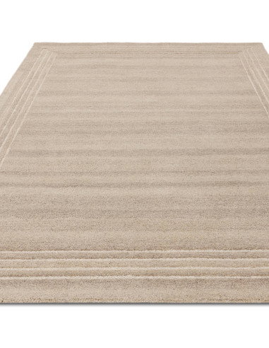 Elevate your space with the Orlo Sand rug, a durable, hand-tufted minimalist rug in a versatile neutral tone for timeless style