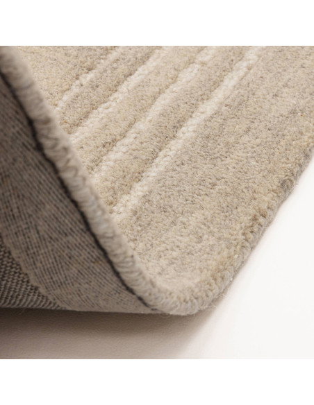 Elevate your space with the Orlo Sand rug, a durable, hand-tufted minimalist rug in a versatile neutral tone for timeless style