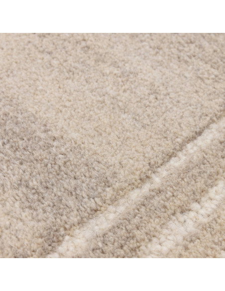 Elevate your space with the Orlo Sand rug, a durable, hand-tufted minimalist rug in a versatile neutral tone for timeless style