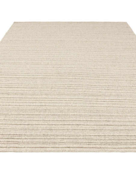 Discover the Ravine Ivory rug, a handcrafted minimalist rug with a soft neutral tone, perfect for adding warmth and elegance to