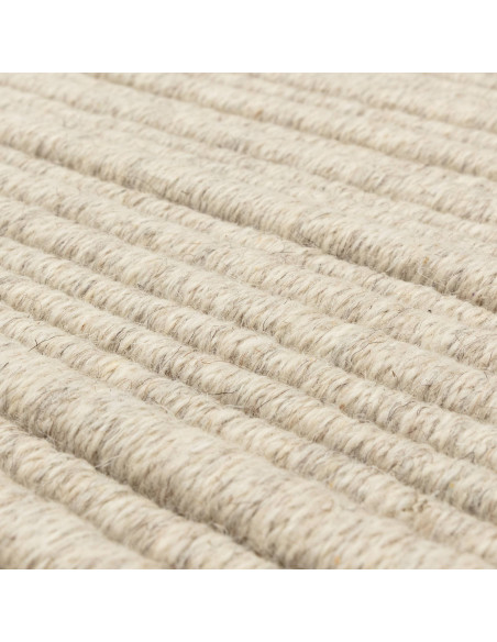 Discover the Ravine Ivory rug, a handcrafted minimalist rug with a soft neutral tone, perfect for adding warmth and elegance to