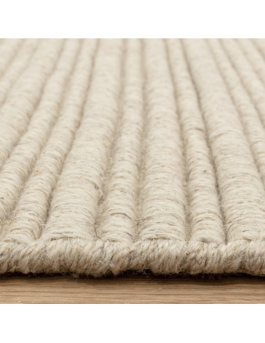 Discover the Ravine Ivory rug, a handcrafted minimalist rug with a soft neutral tone, perfect for adding warmth and elegance to