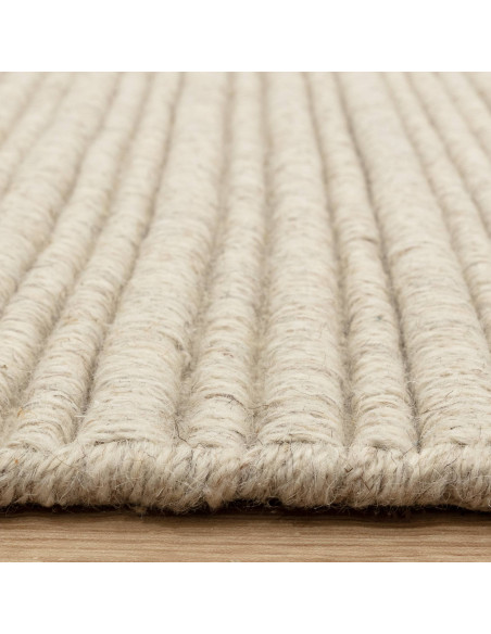 Discover the Ravine Ivory rug, a handcrafted minimalist rug with a soft neutral tone, perfect for adding warmth and elegance to
